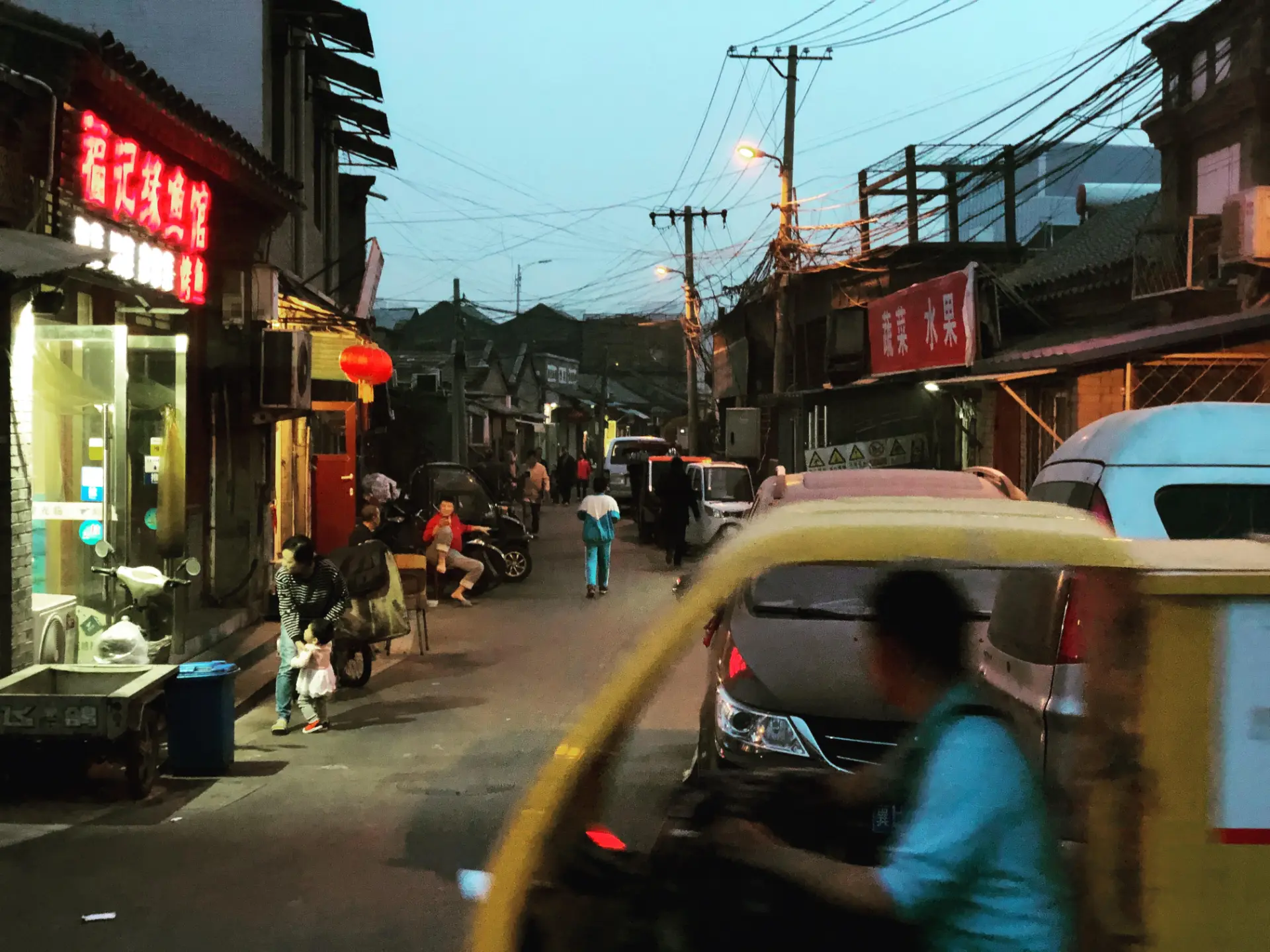 Dusk in a narrow hutong street — original 73 Productions photography